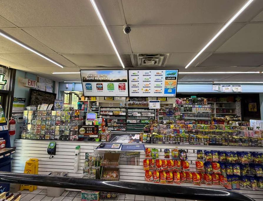 Lottery installation screens inside of a convenience store.