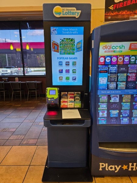 Lottery scratch-off machine inside of a convenience store.